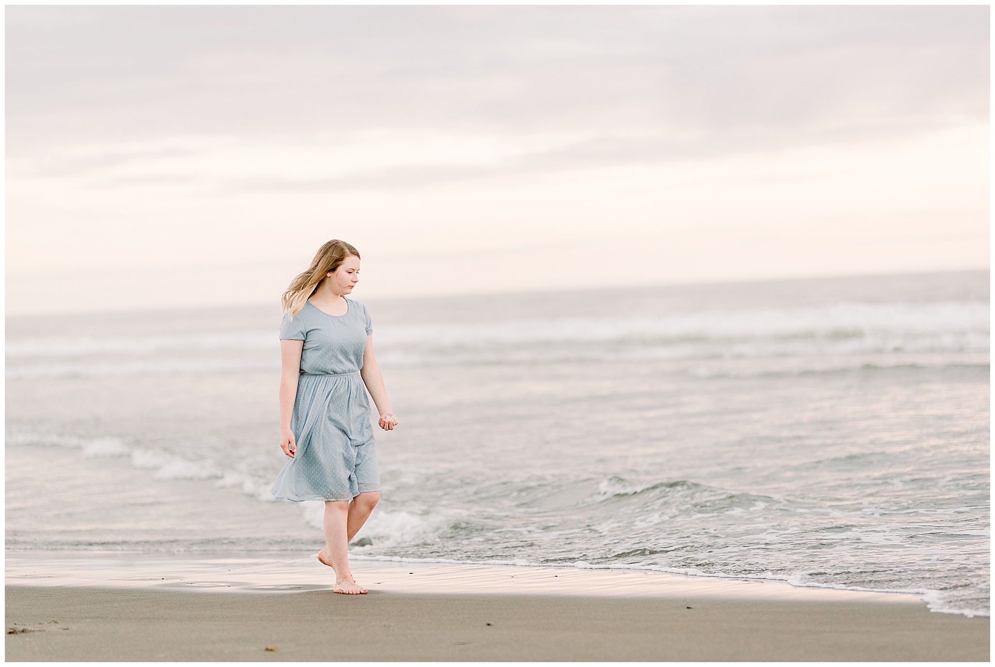 Teenage girl walking along the beach in Pacific City, Oregon